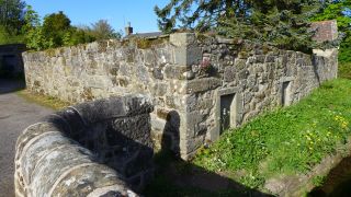 Ruined cottage next to the bridge