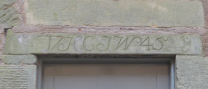 Lintel over doorway in passage leading to car park